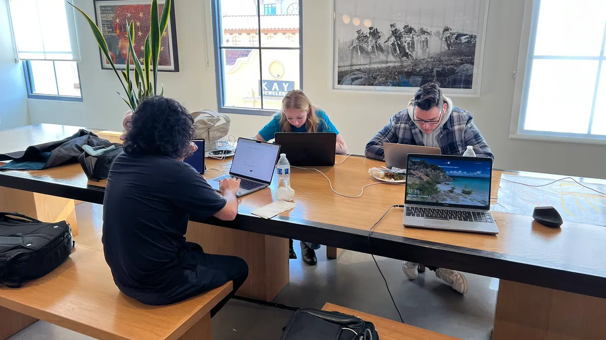 YouChef team working on laptops